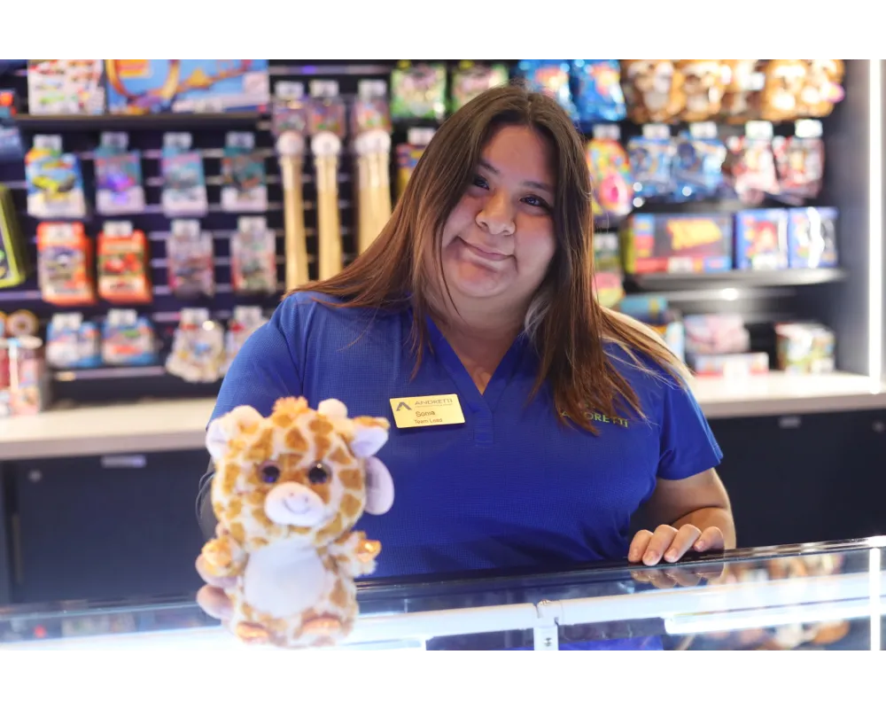 a woman holding a stuffed animal
