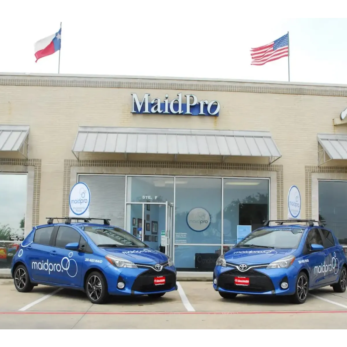 MaidPro Katy branded wrapped cars sitting outside of the location in Texas