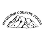 Black and white logo of Mountain Country Foods featuring stylized mountain peaks with text above them.