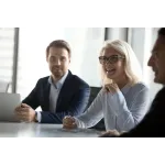 a man and a woman sitting on a table