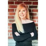 a woman with her arms crossed