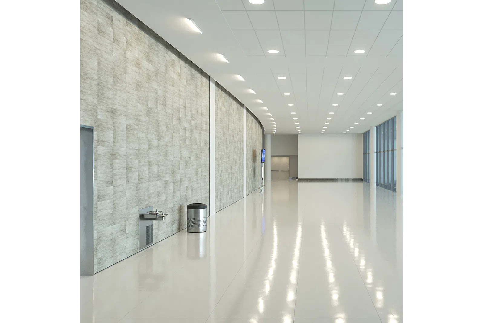 Bright modern hallway with polished floor, large windows, textured wall, drinking fountain, and trashcan.