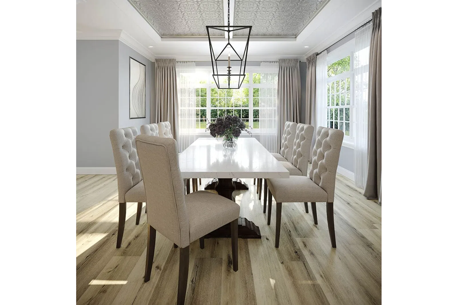 Bright modern dining room with tufted beige chairs, white table, large windows, wood floor, and geometric pendant light