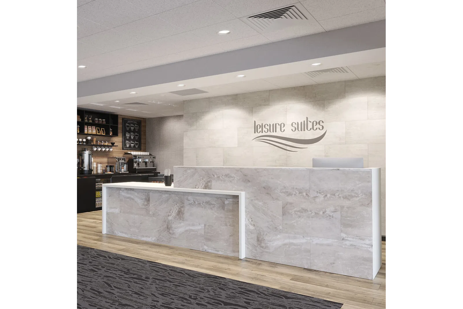 Modern hotel reception desk with marble finish and coffee bar in the background under recessed lighting.