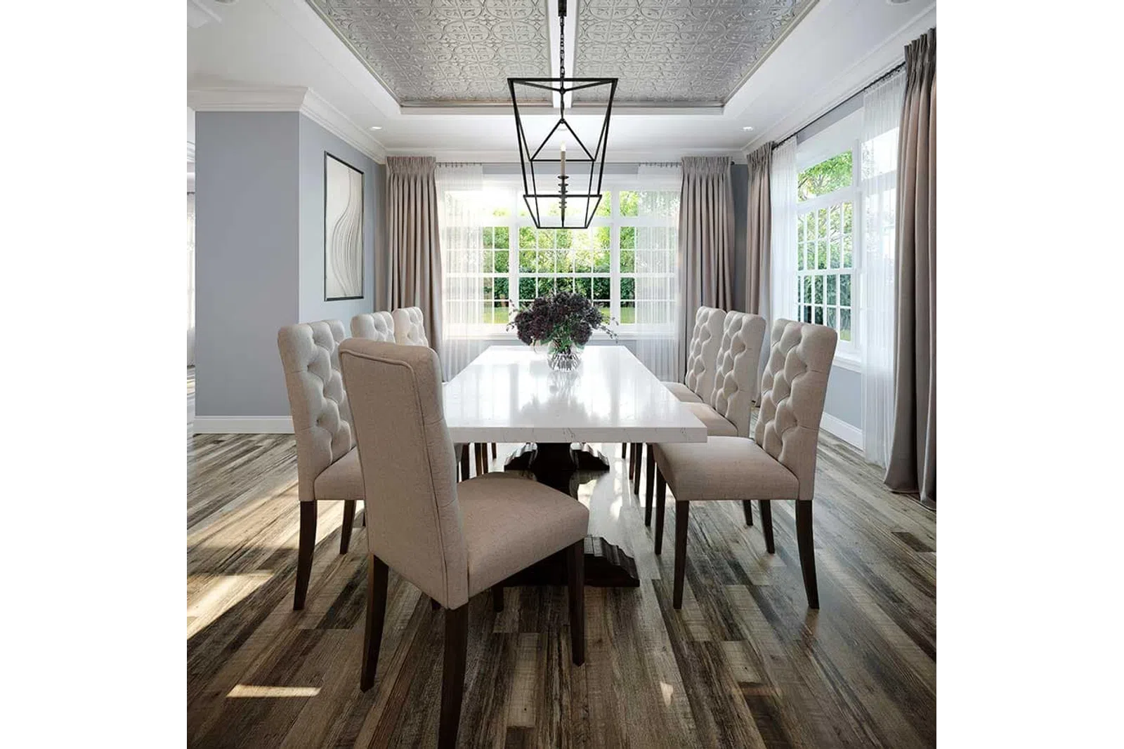 Bright dining room with a white table, beige tufted chairs, wooden floors, and large windows with curtains.