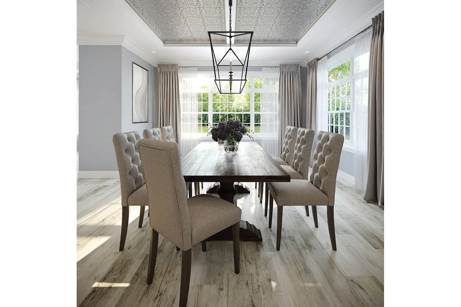 Bright dining room with a wooden table, eight tufted beige chairs, large windows, and a geometric chandelier.