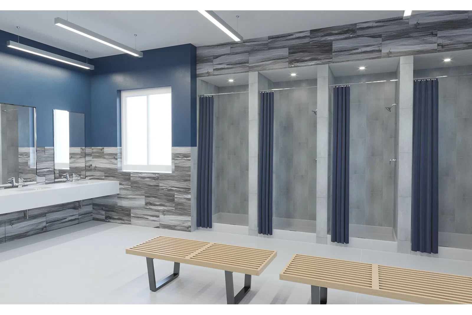Modern locker room with blue and gray tile walls, wooden benches, sinks, mirrors, and shower stalls with navy curtains.