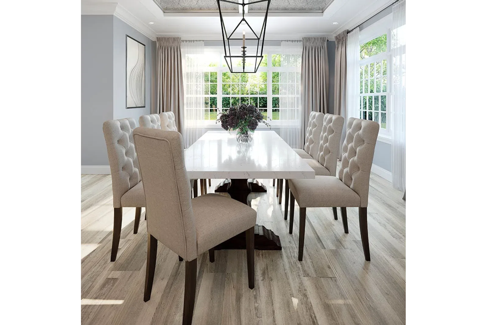 Modern dining room with beige tufted chairs, white marble table, large windows, and natural wood flooring.