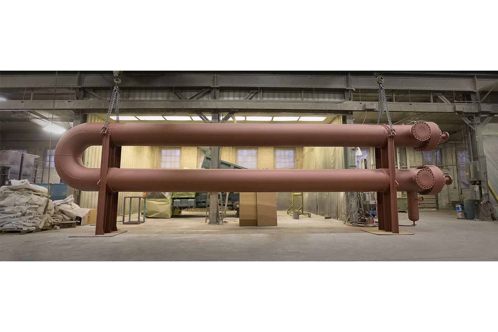 a large metal pipe in a warehouse