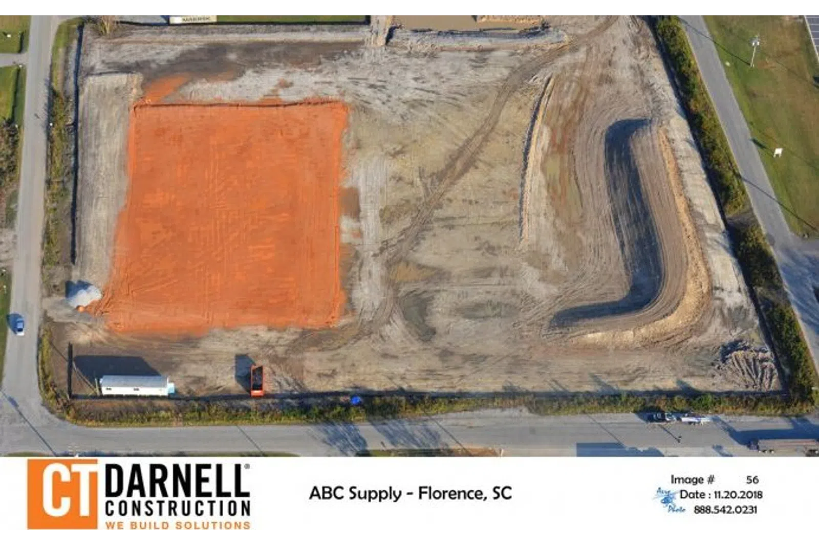 Aerial view of a construction site with cleared land and excavation in Florence, SC by CT Darnell Construction.