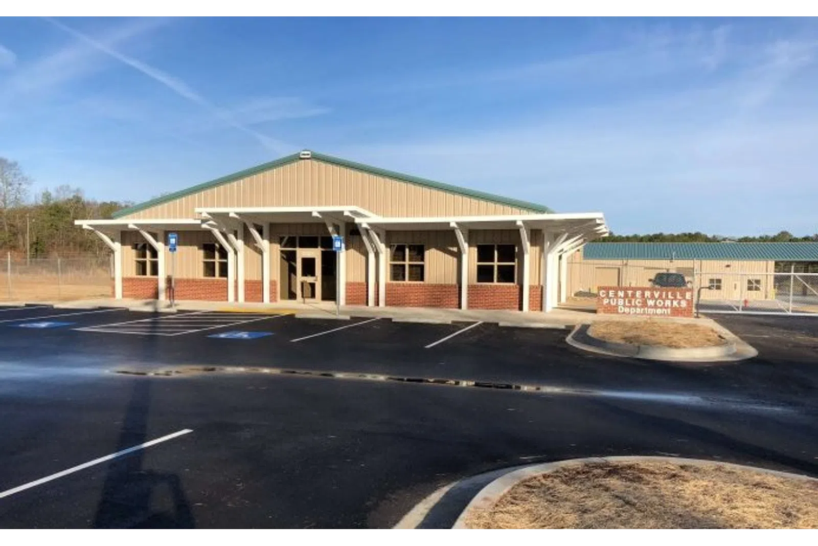 Centerville Public Works Department building with parking lot and clear blue sky in the background