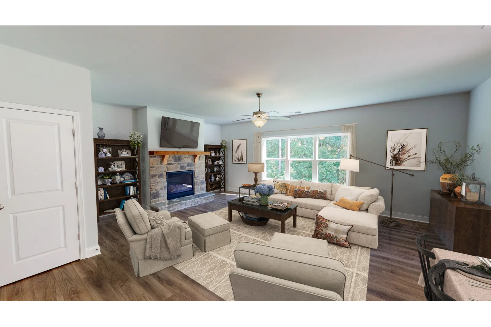 a living room filled with furniture and a flat screen tv