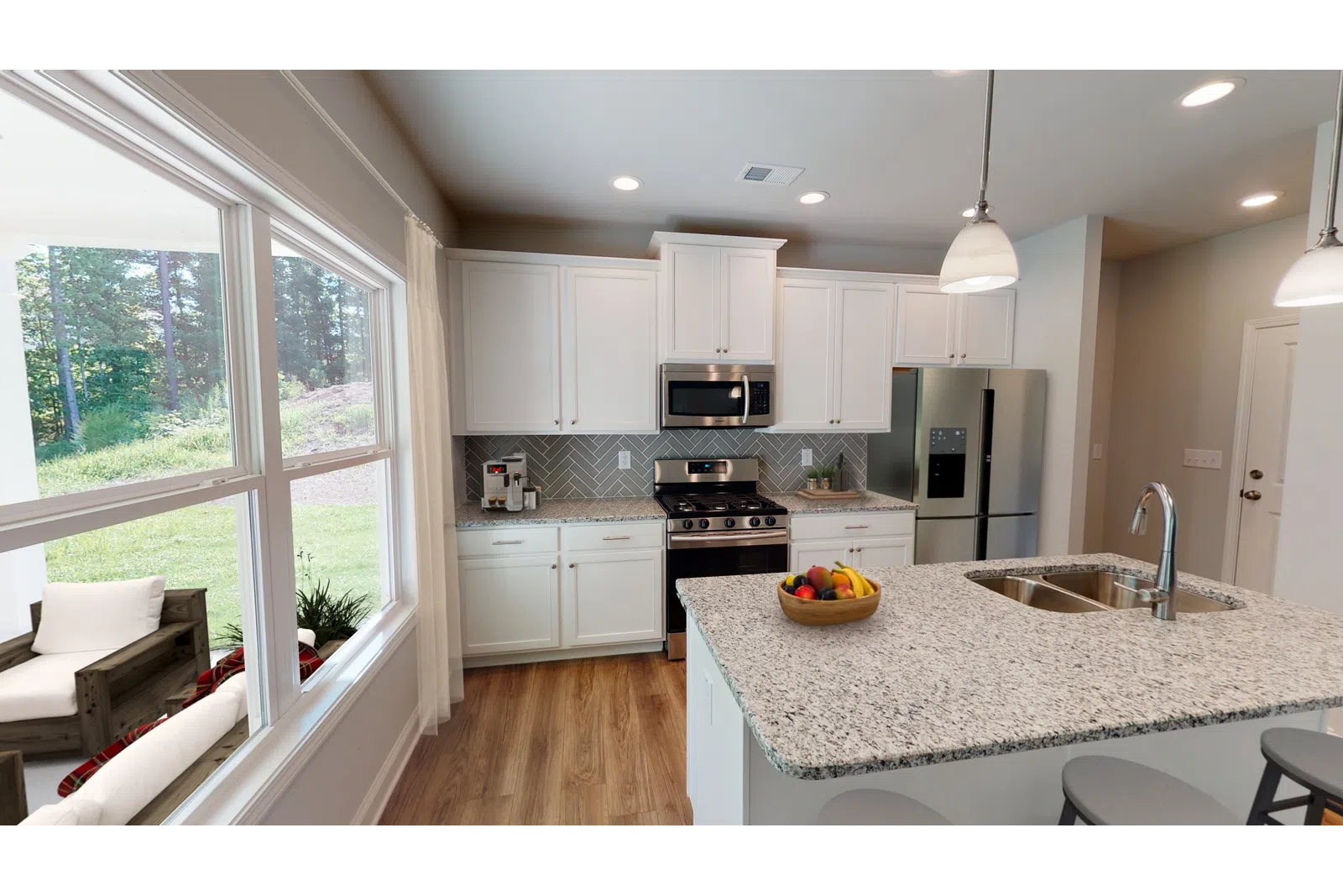 a modern kitchen with an island in the middle of a room