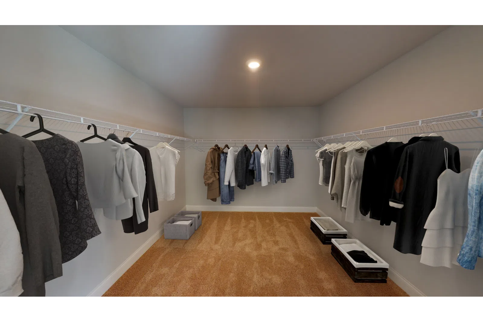 a bedroom with a bed and desk in a room