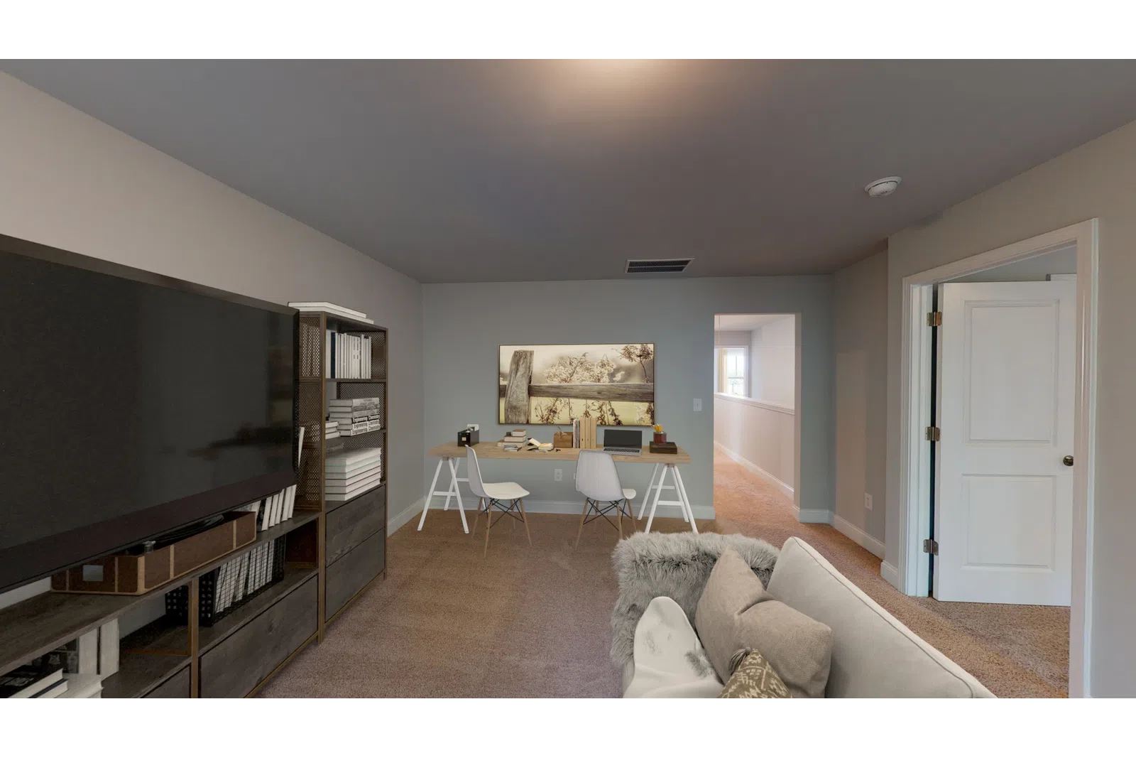 a living room filled with furniture and a flat screen tv