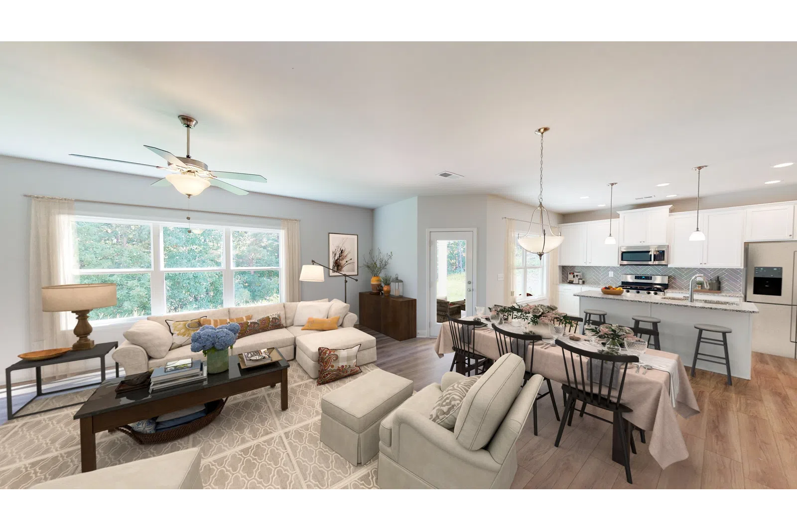 a living room filled with furniture and a large window