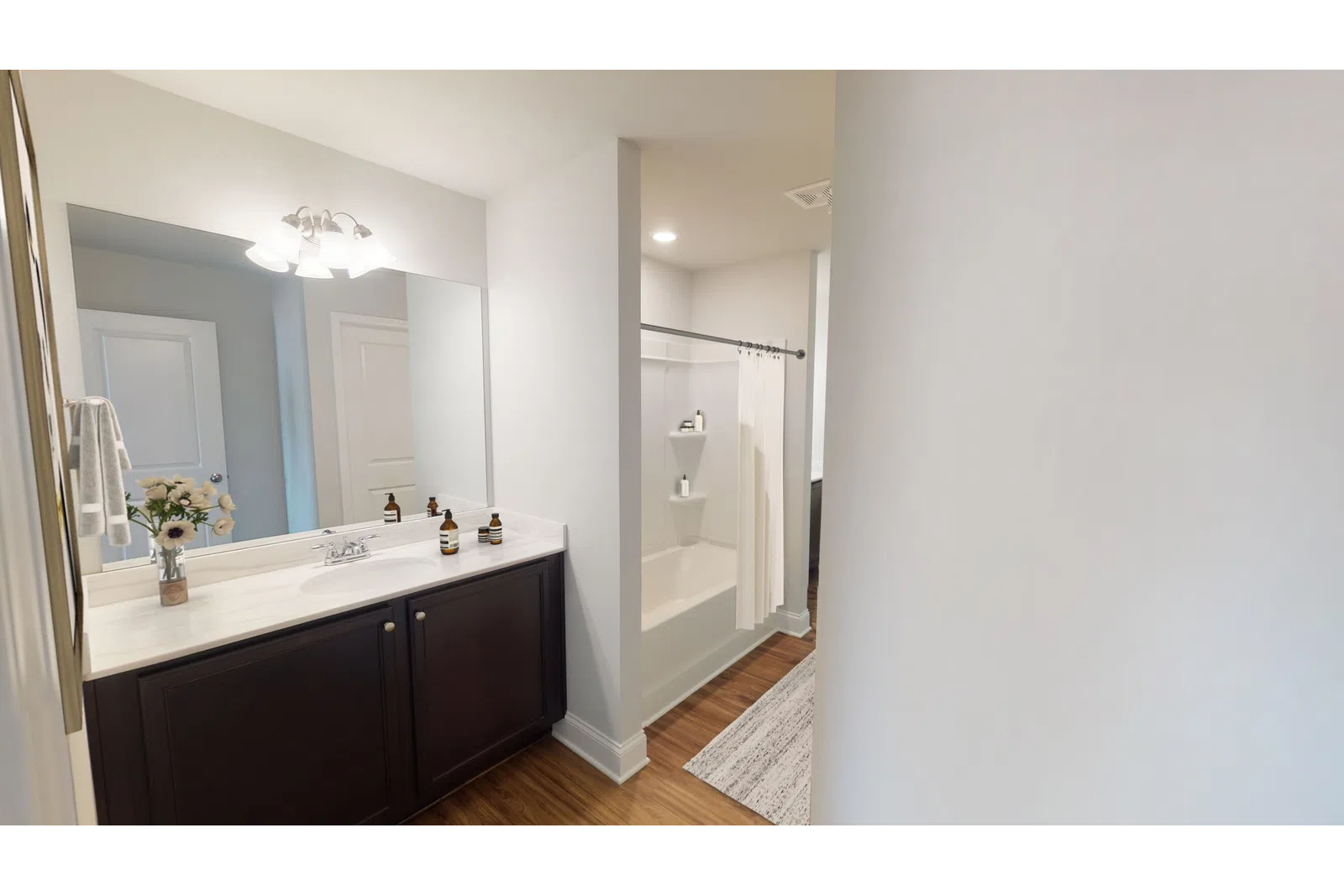 a kitchen with a sink and a mirror