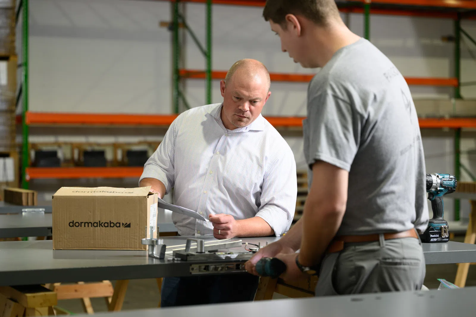 a couple of men working in a factory