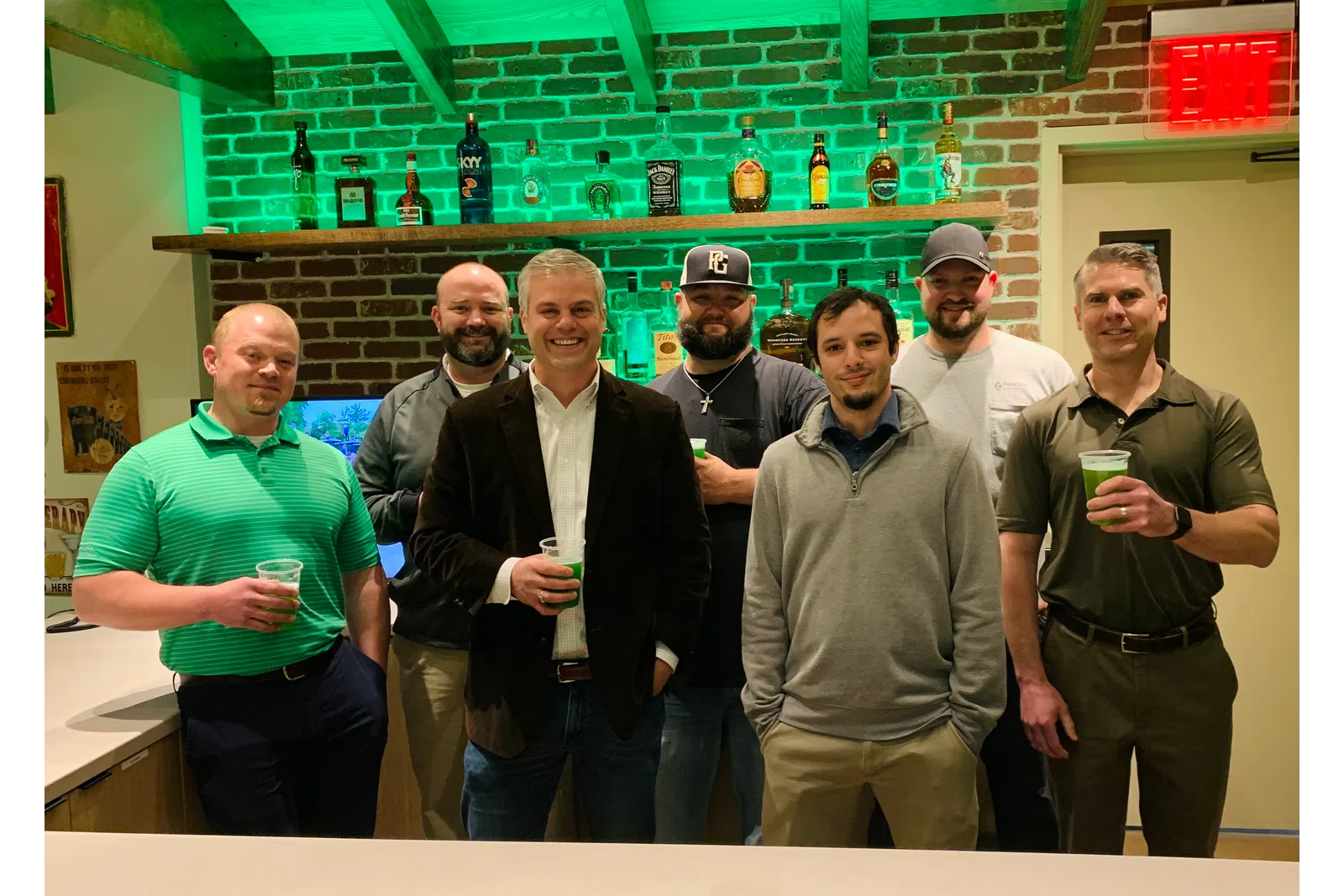 a group of men posing for a photo