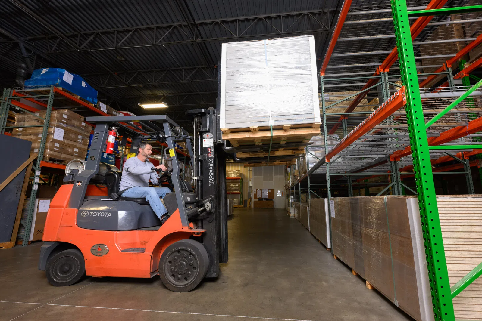 a person driving a forklift