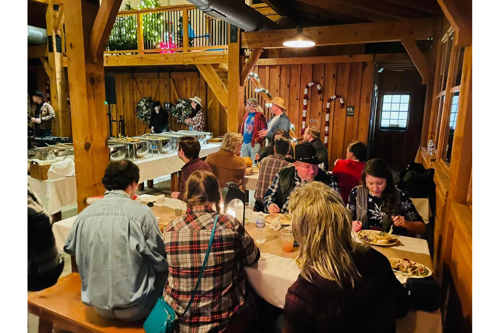 a group of people eating at a restaurant