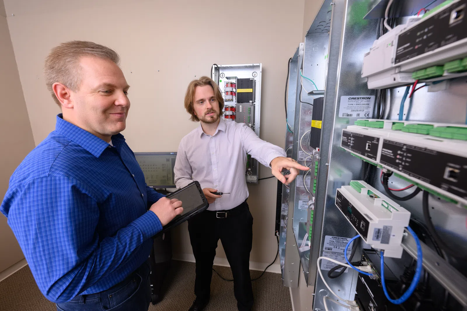men working in a server room