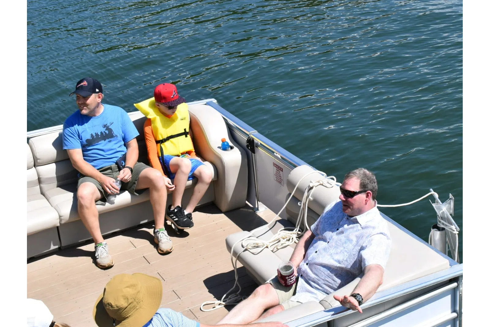 a group of people sitting on a boat