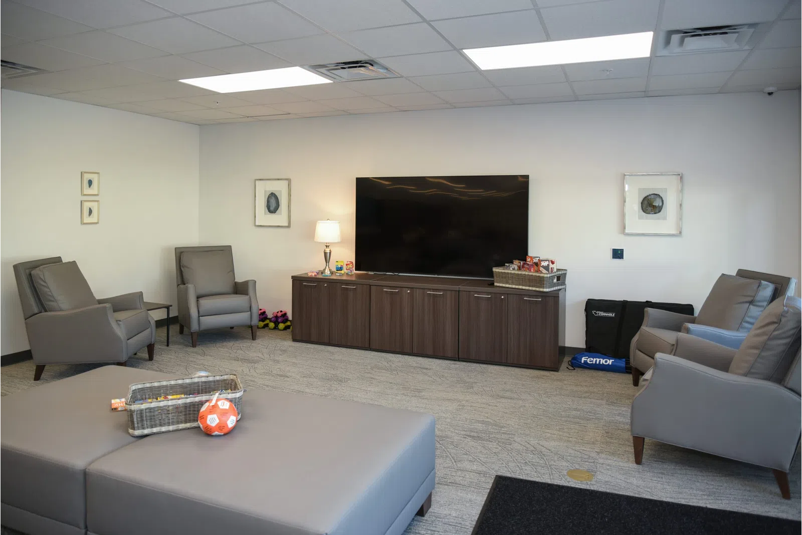 a living room with a tv and couches