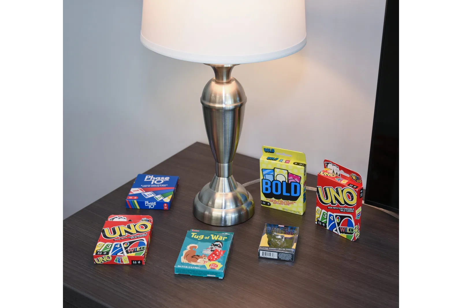 a table with a lamp and boxes of candy on it