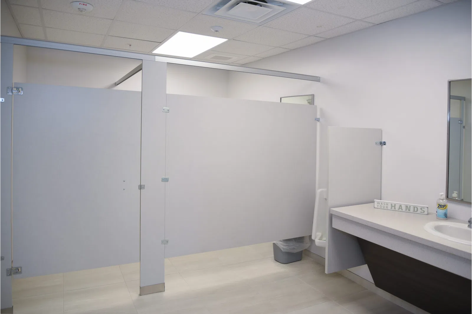a bathroom with a sink and a shower unit