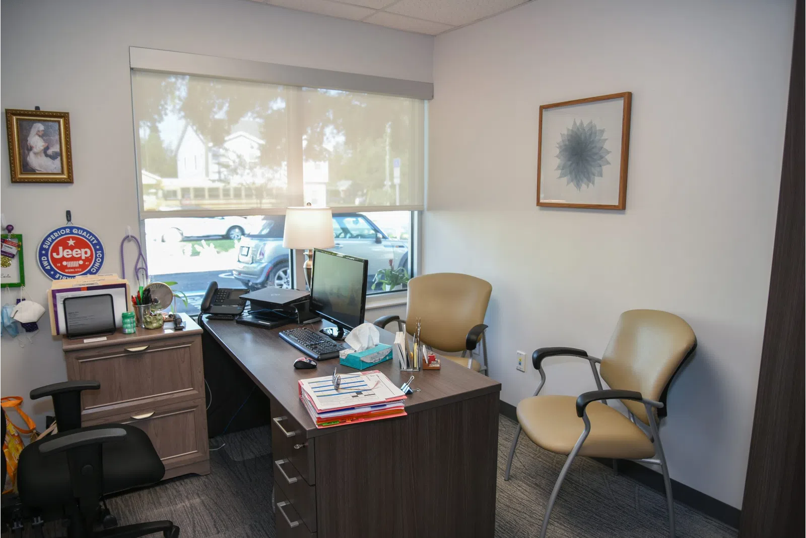 a room with a desk and computer