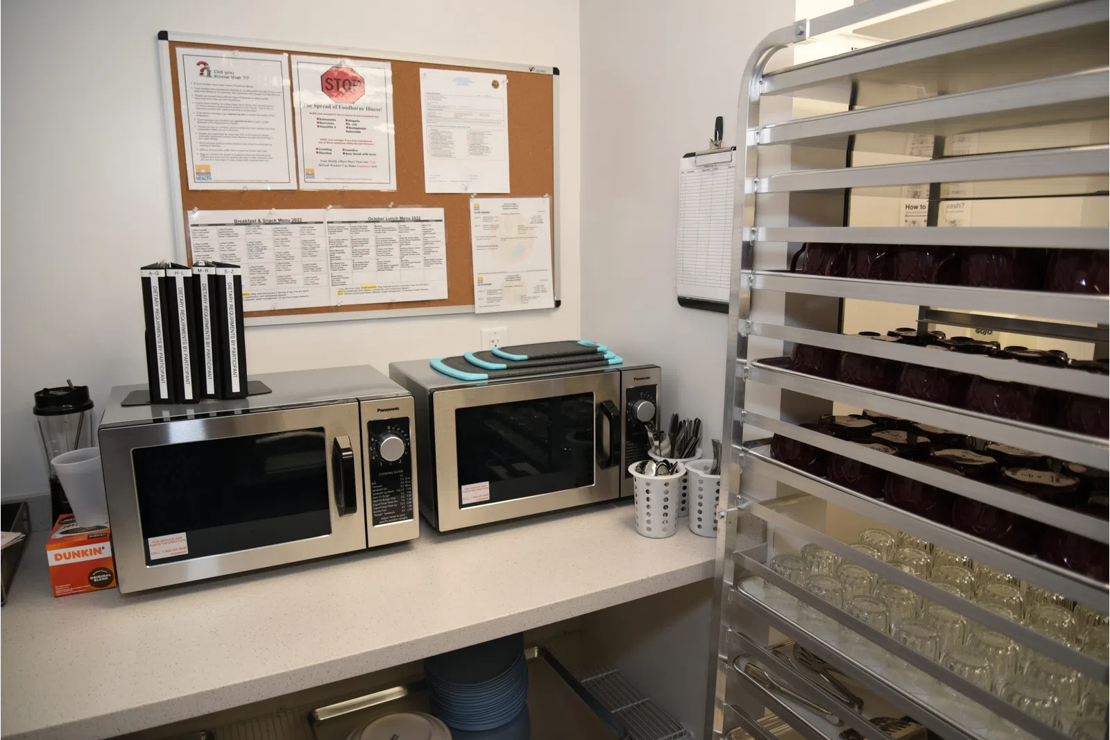 a kitchen with microwaves and refrigerator
