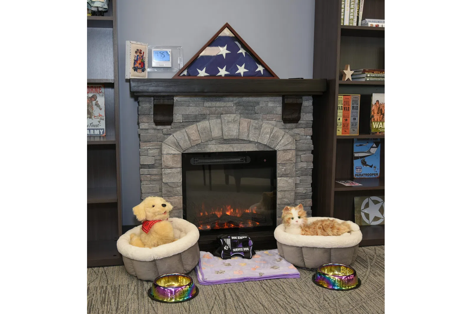 a fireplace with a stuffed animal in front of it