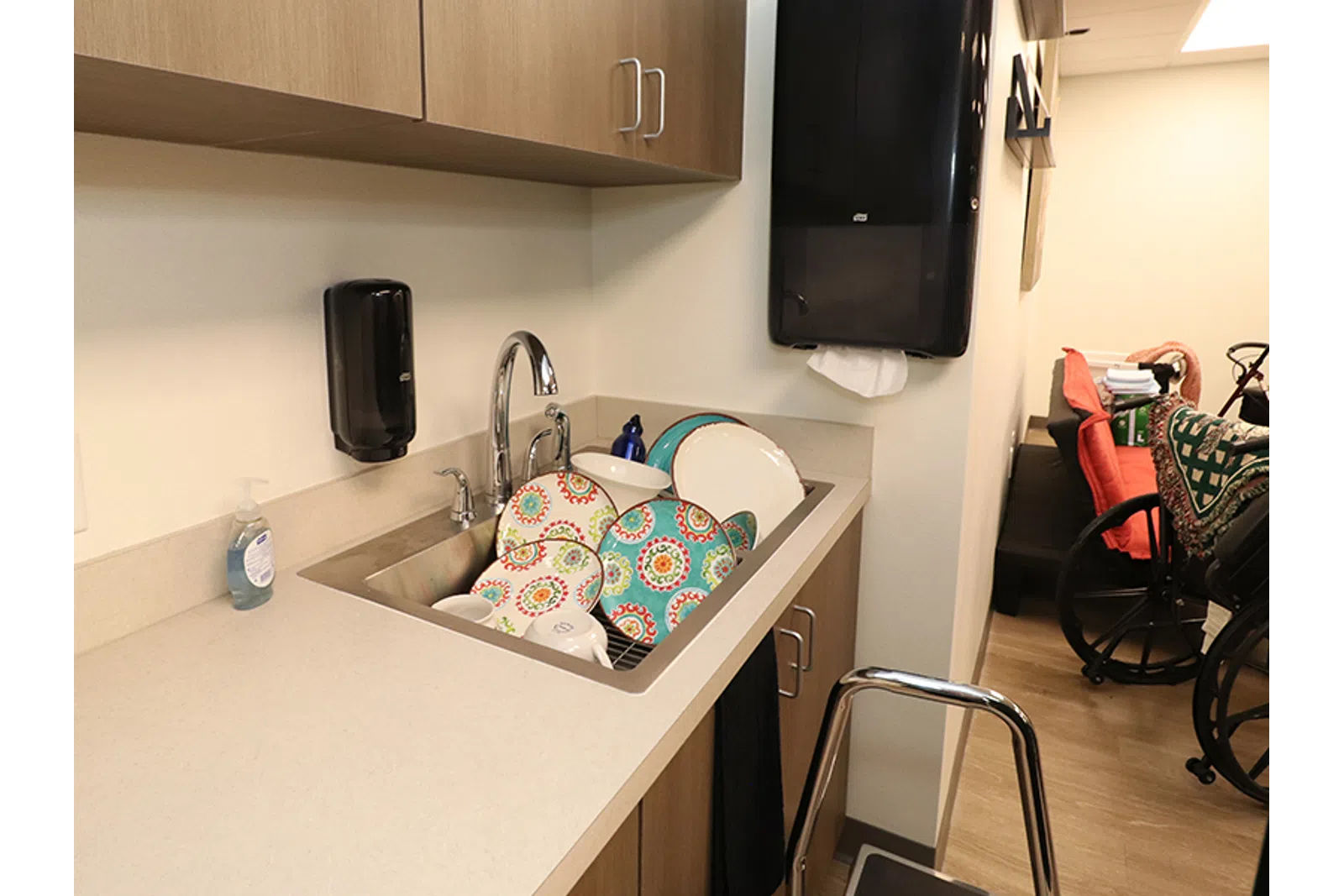 a kitchen with a tv and a sink