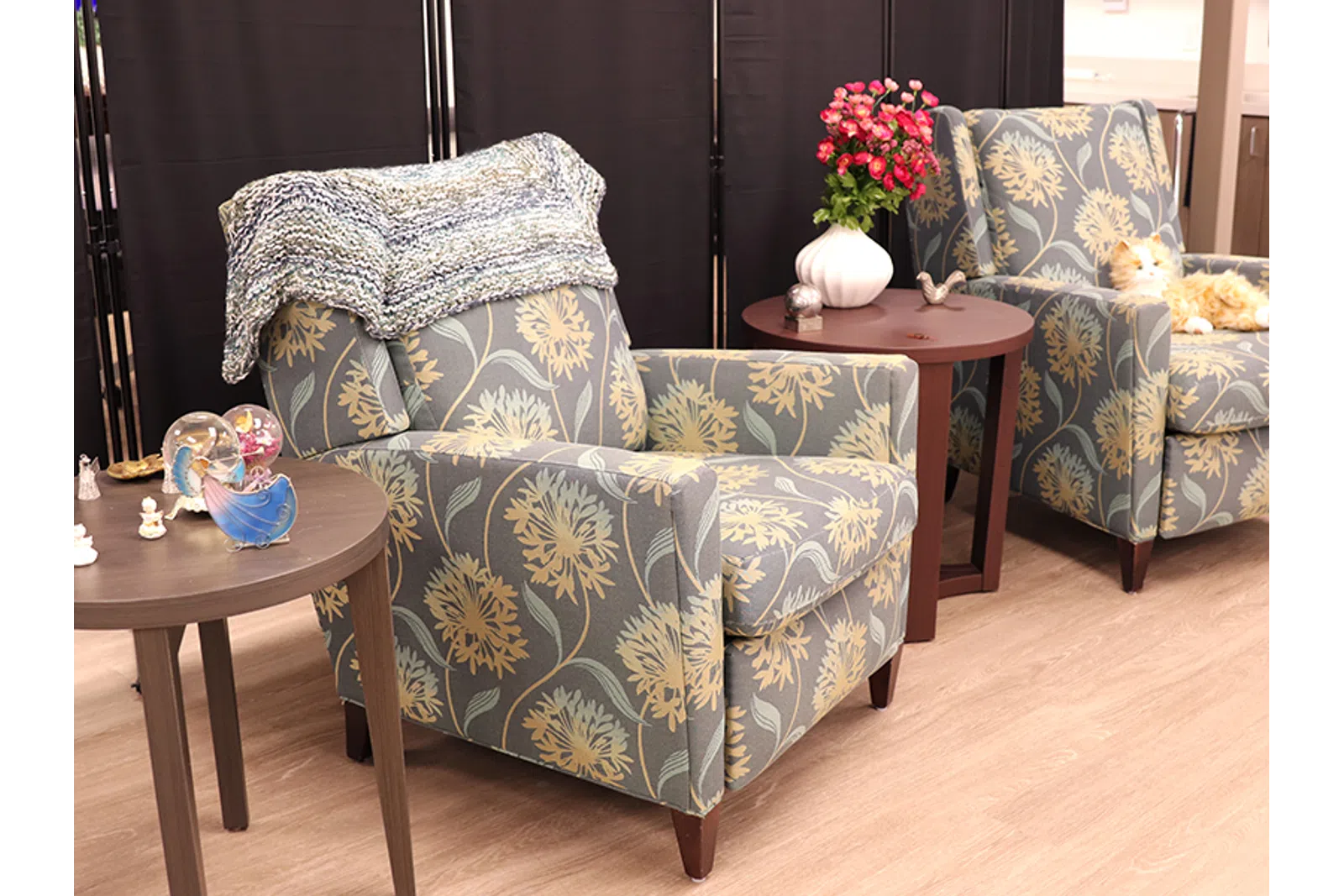 a couple of chairs with flowers on them