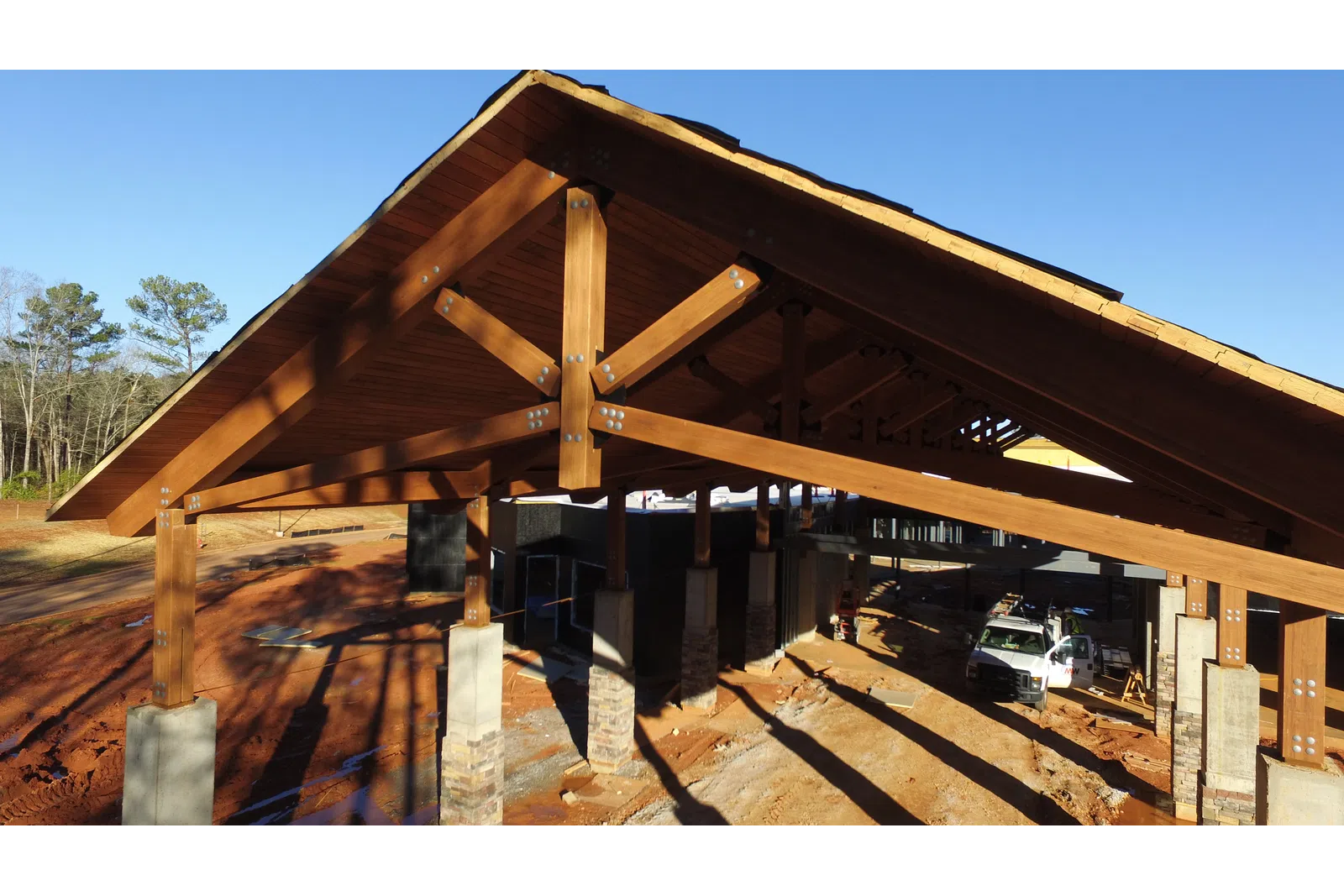 a wooden bridge with a car parked underneath
