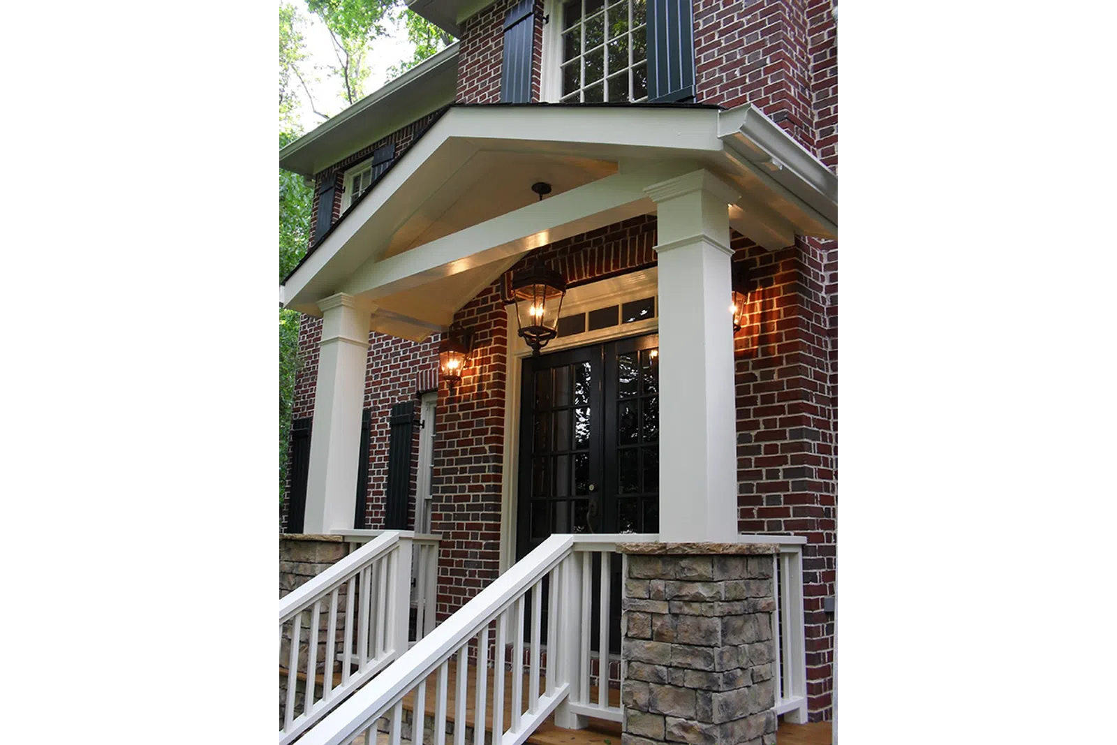 a porch with a white railing