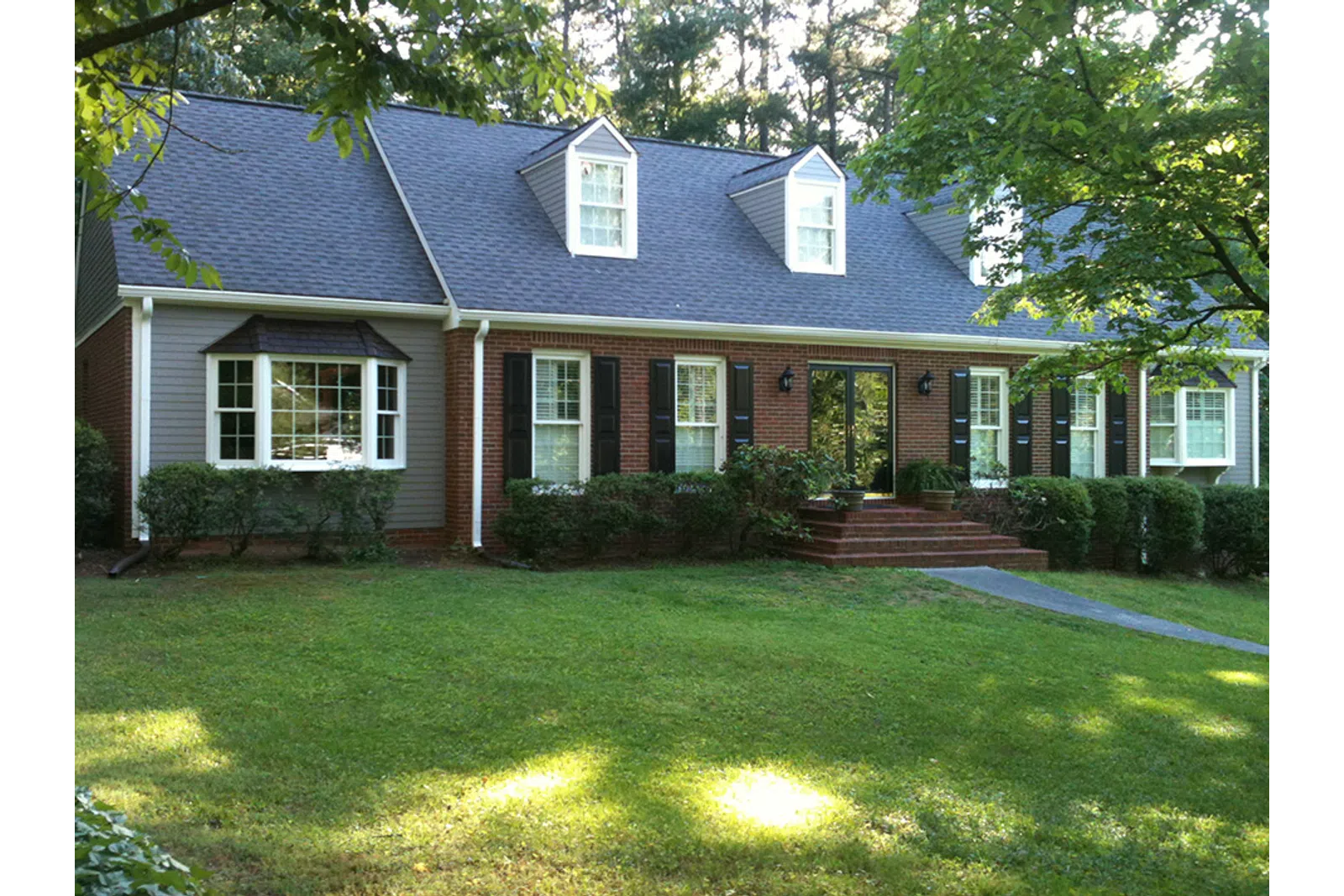 a house with a lawn in front of it