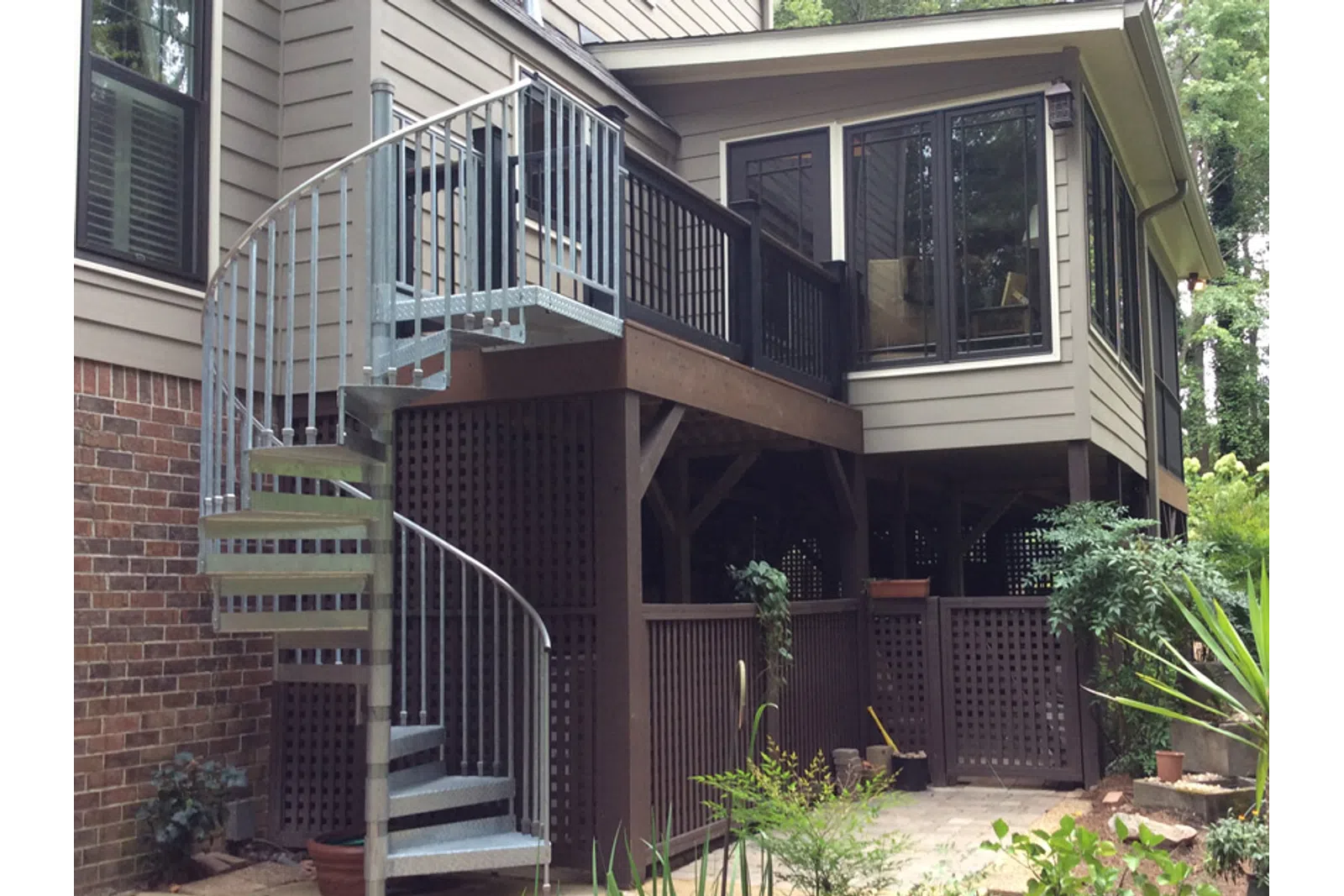 a house with a deck and a fence