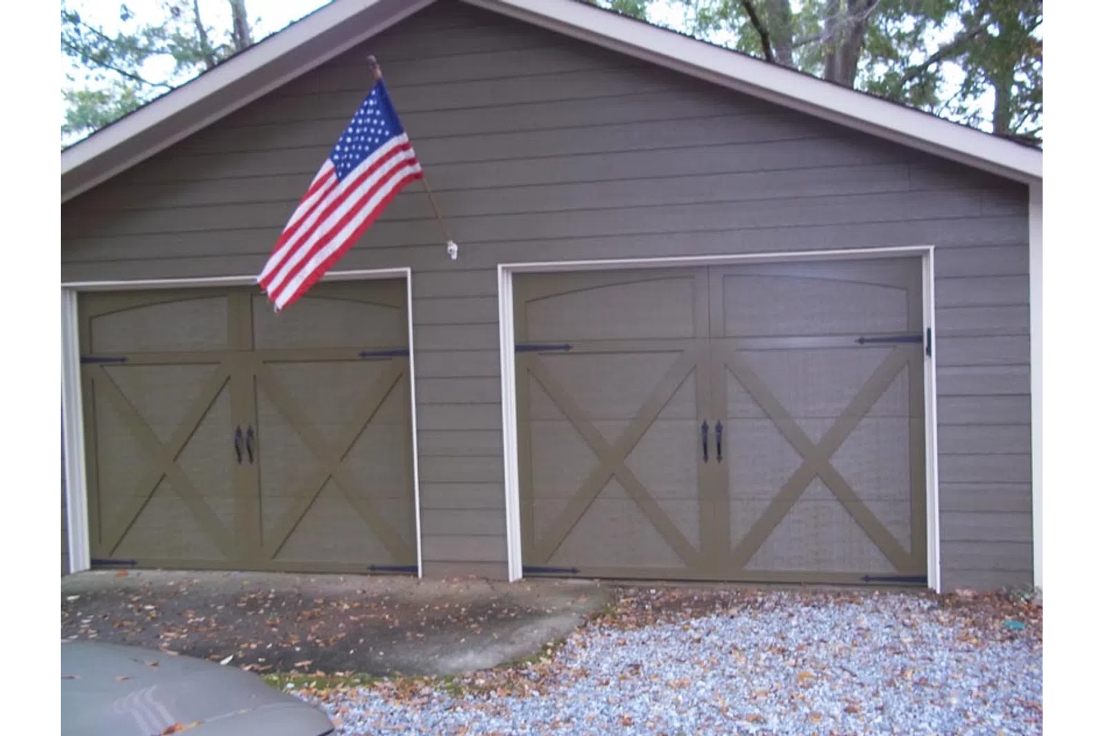 a garage door with a flag on top