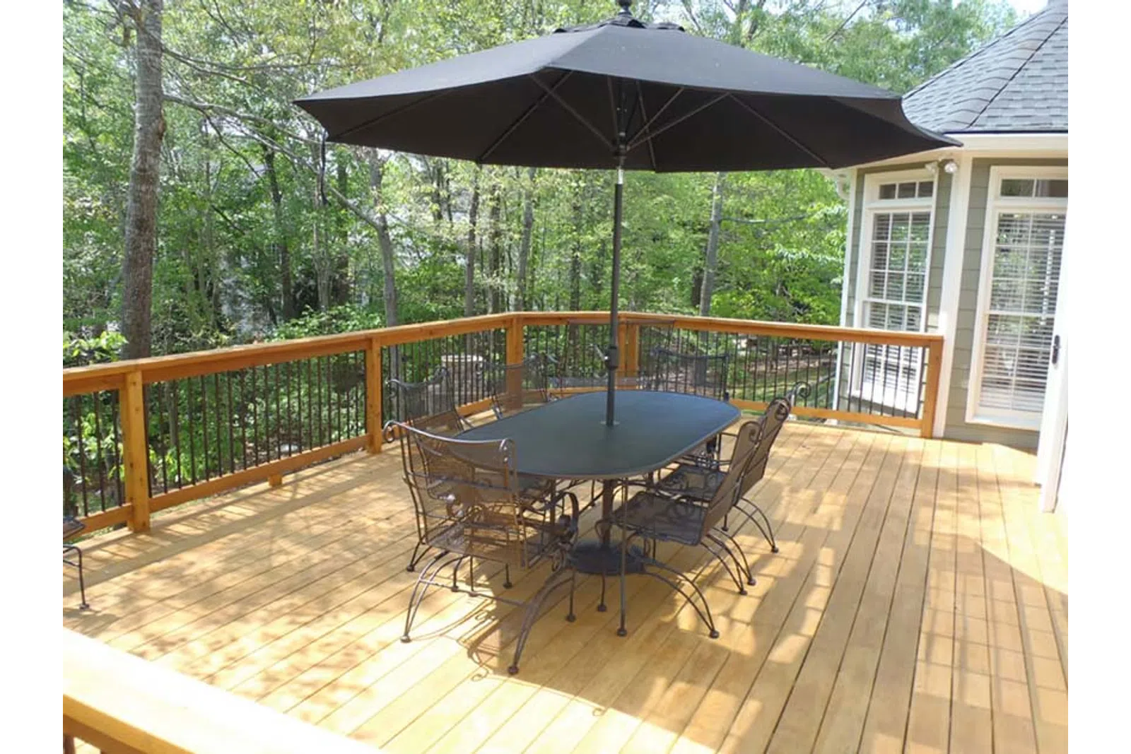 a table and chairs on a deck