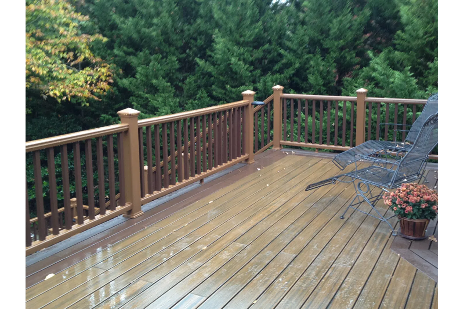 a deck with a chair and a table on it