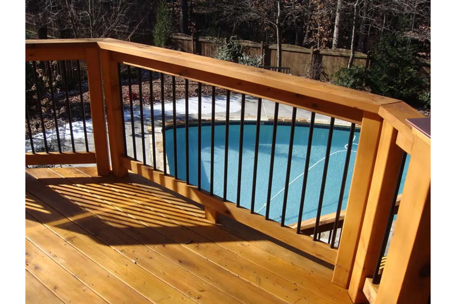 a wooden bridge over a pool