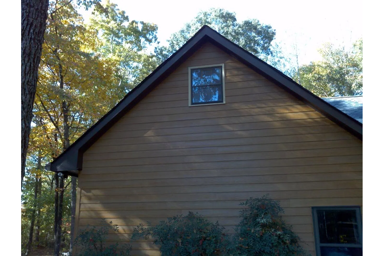 a wooden house with a window