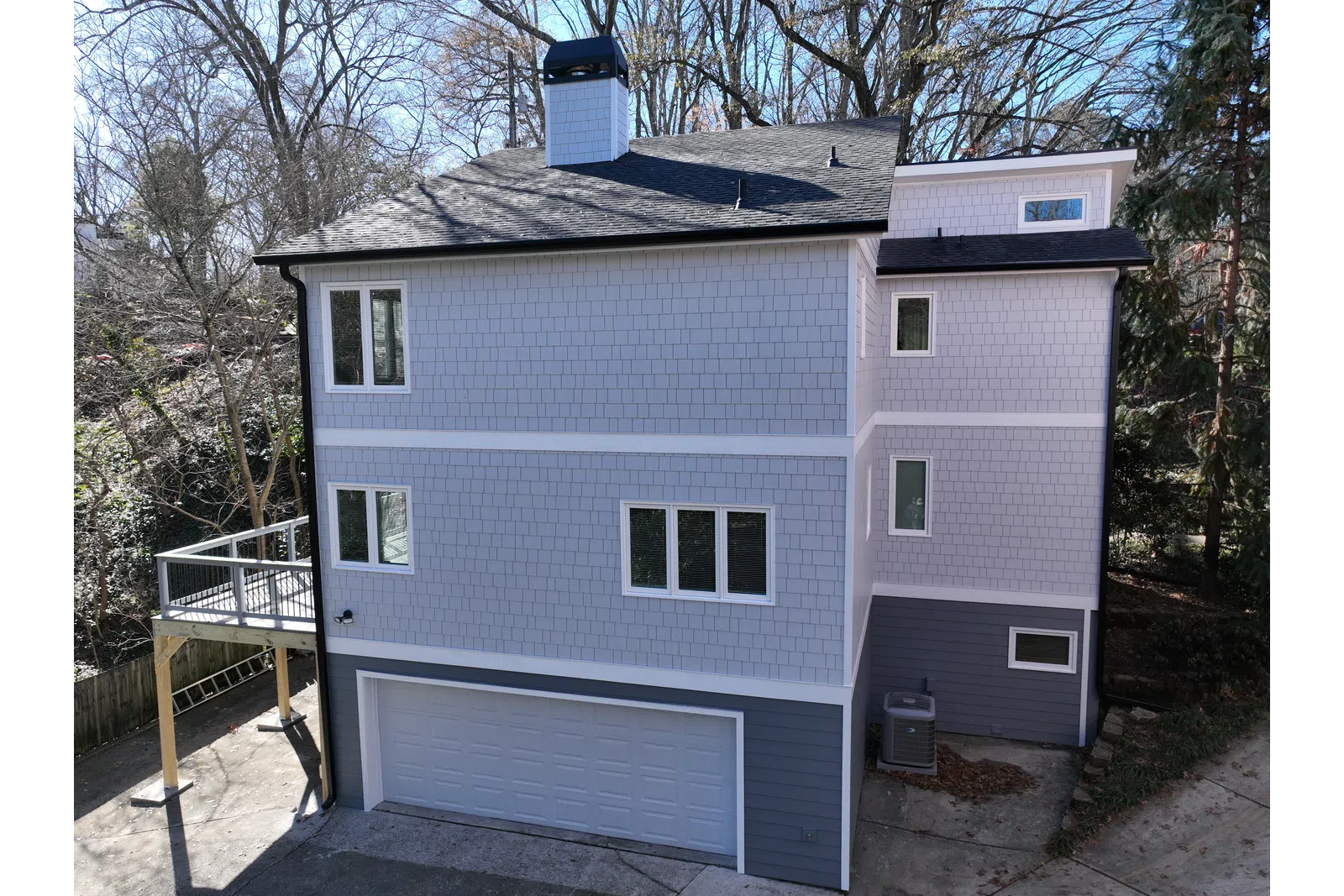 a grey house with a garage