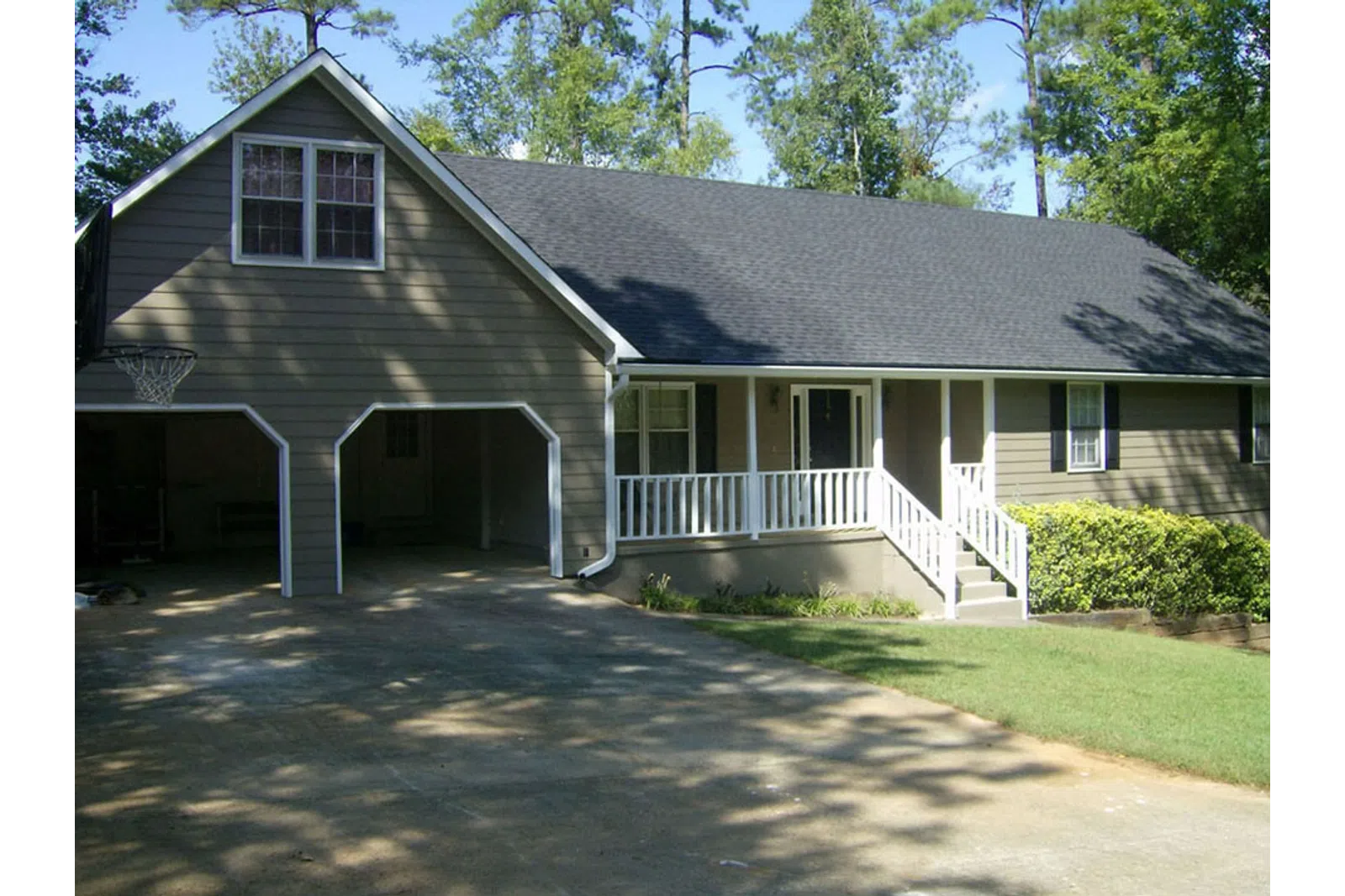 a house with a lawn and trees