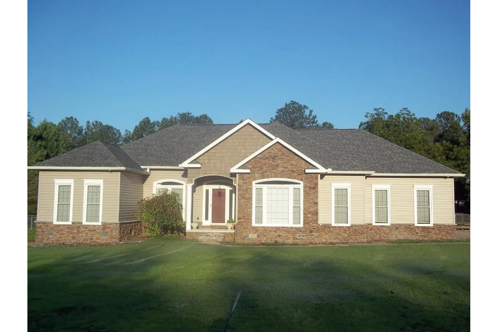a house with a lawn in front of it