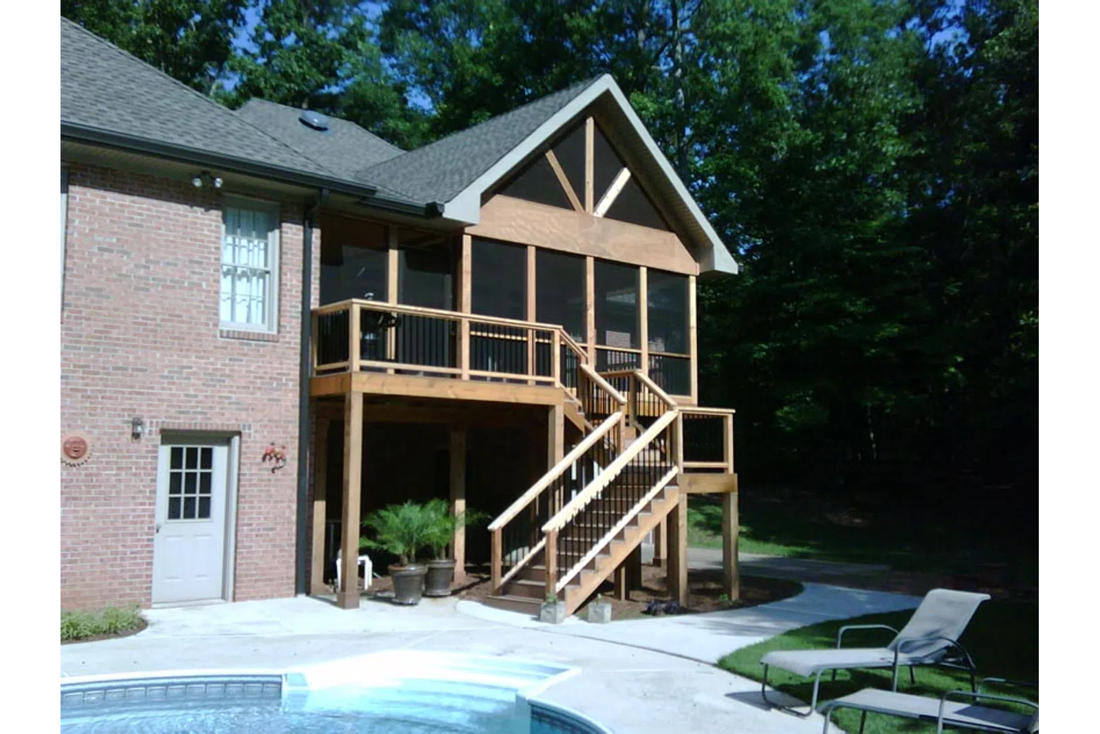 a house with a deck and a pool