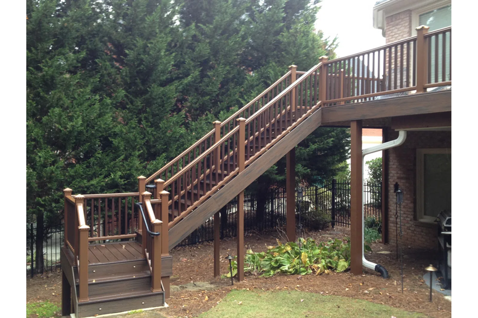 a wooden staircase leading up to a house