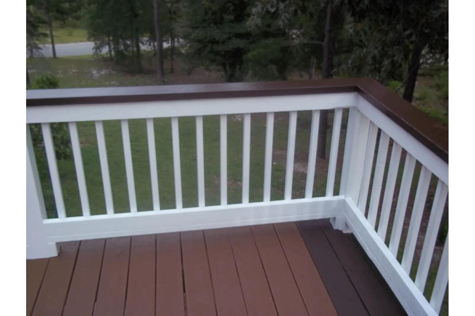 a white railing on a deck